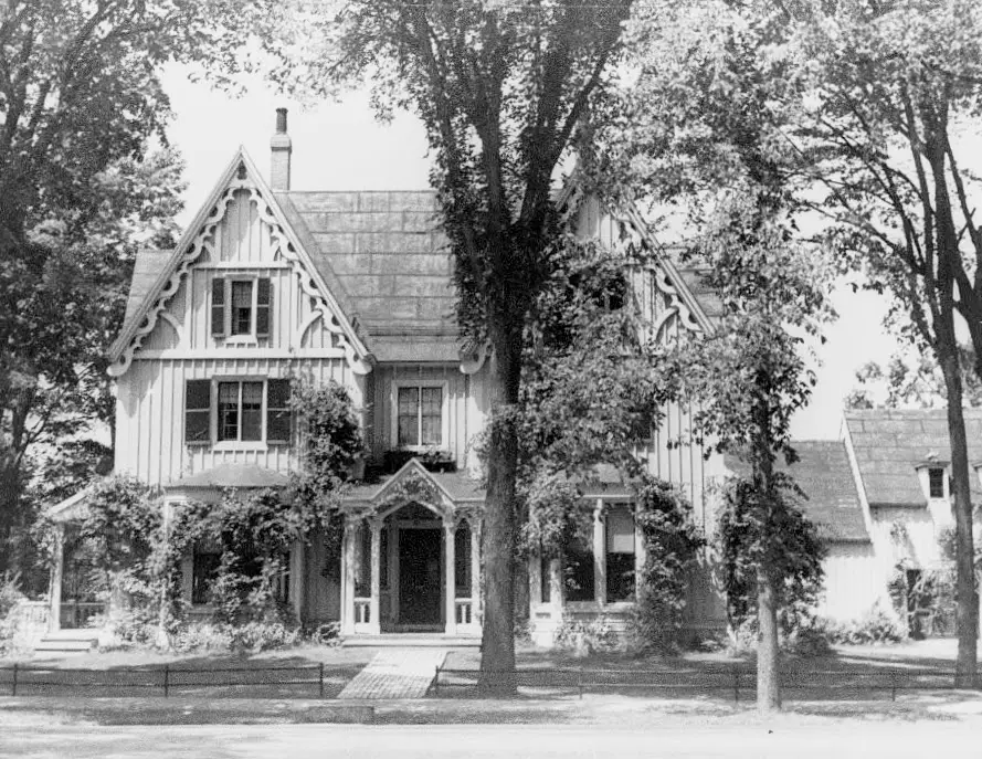 black and white photo of exterior of victorian home