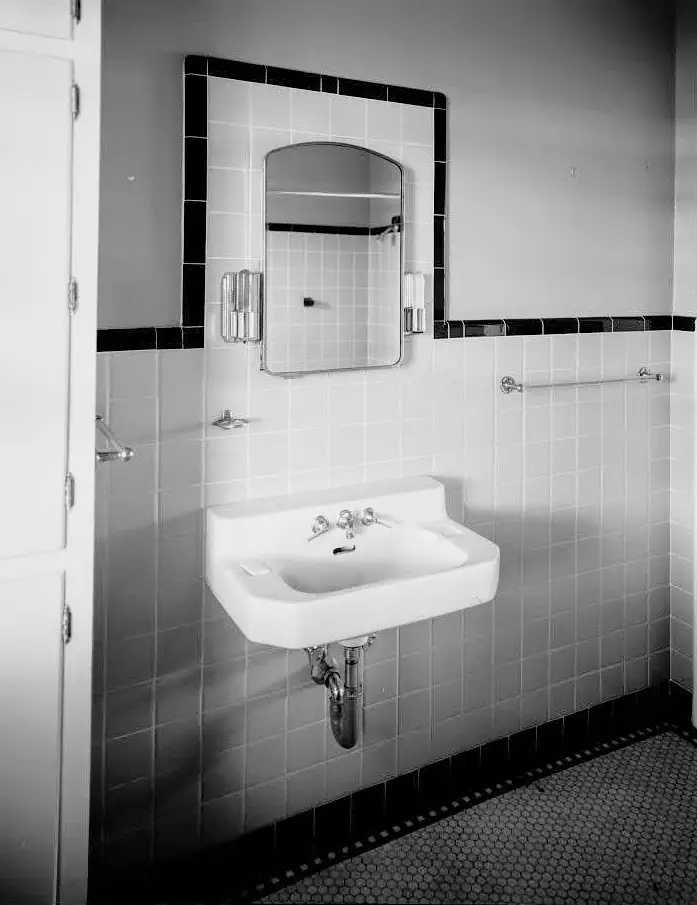 black and white photo of old bathroom