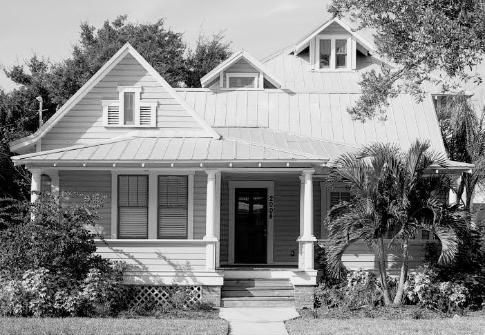 black and white photo of exterior of craftsman home