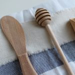 wooden kitchen utensils on dish cloth