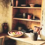 old kitchen with wood shelves and primitve decor