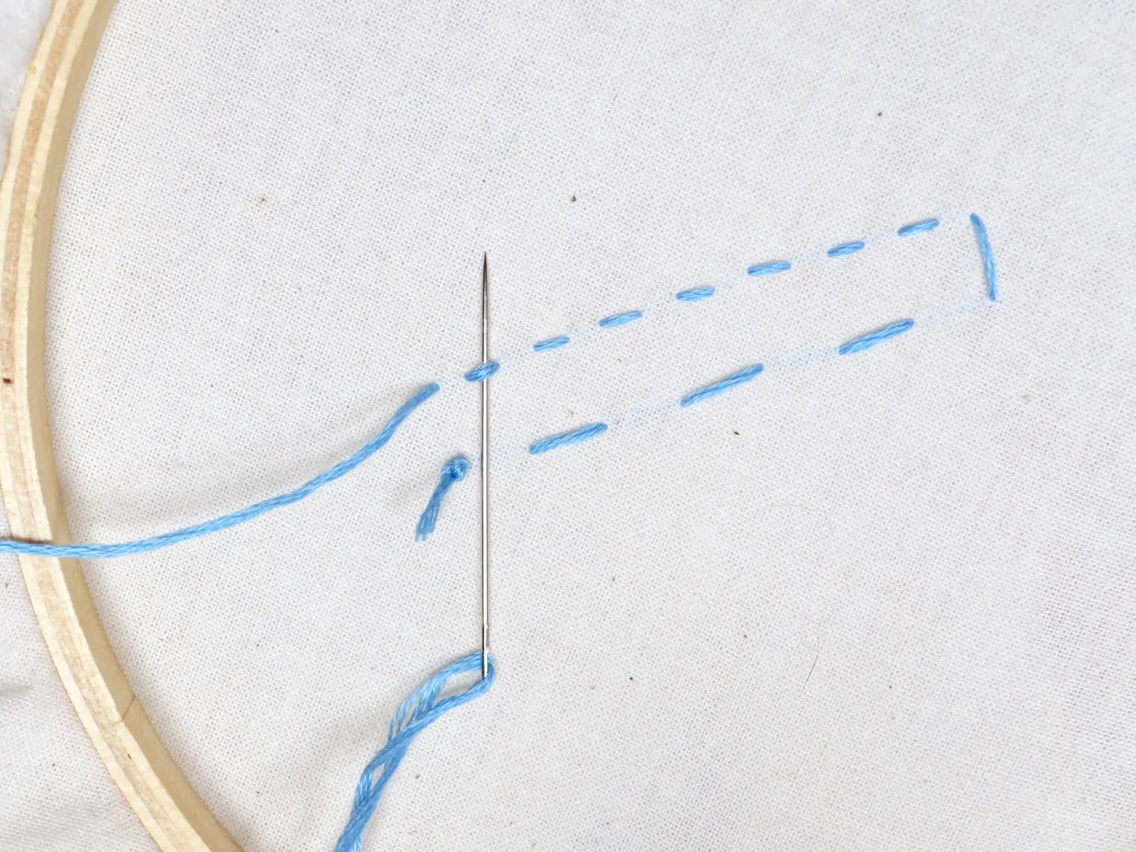 needle on backside of running stitch
