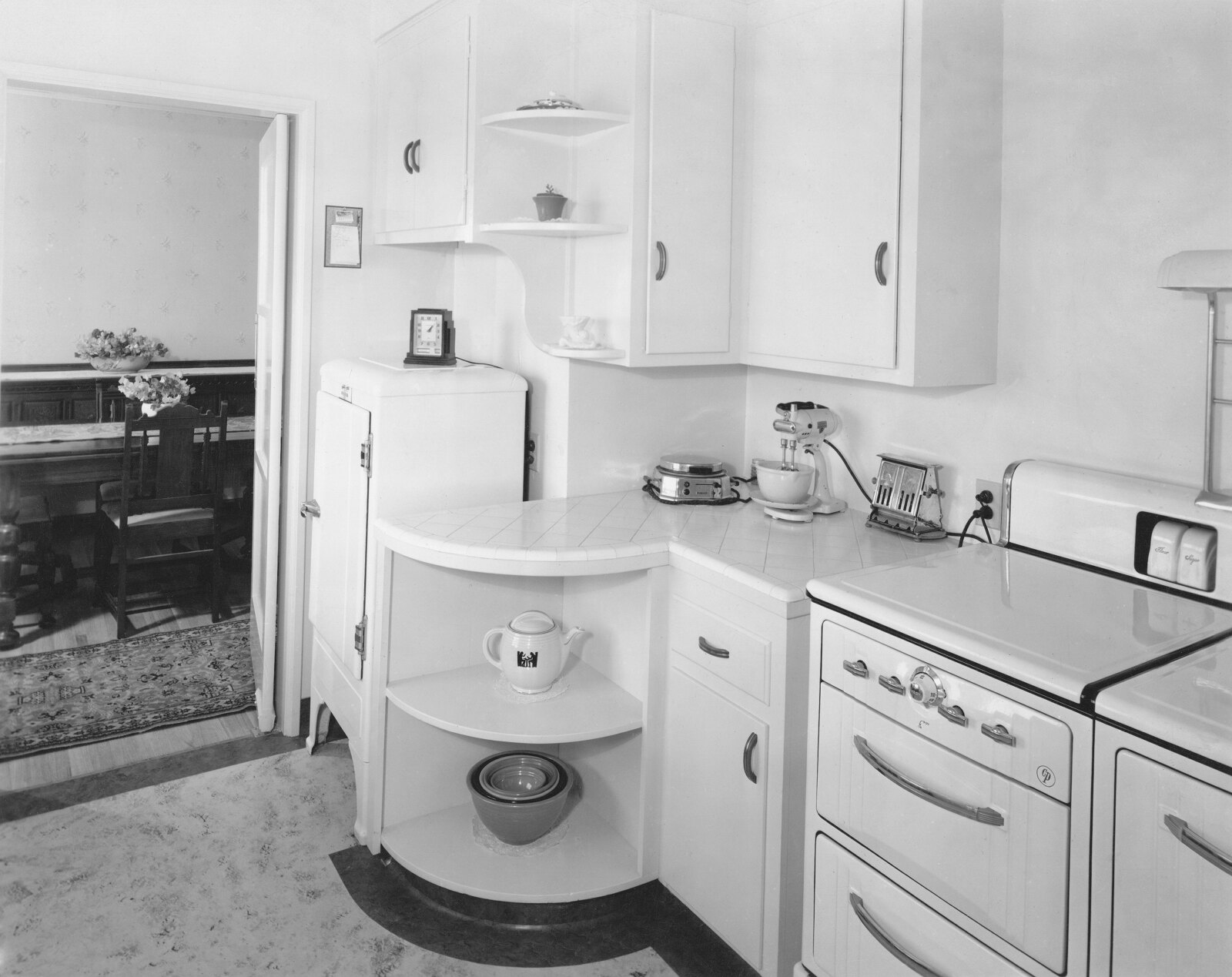 vintage kitchen with icebox in background