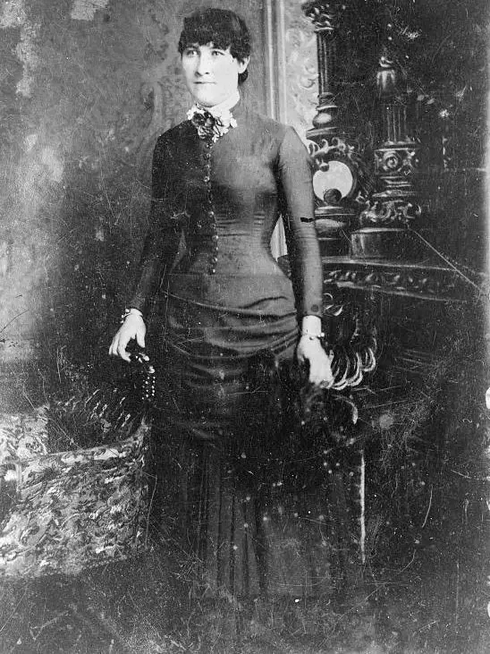victorian woman wearing dress with corset