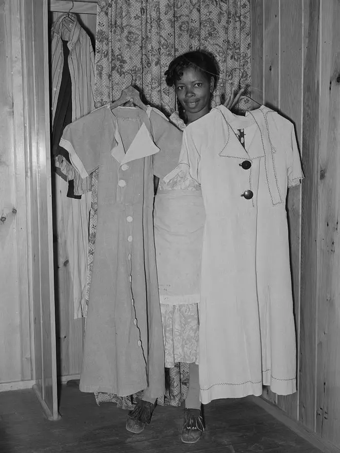 1930s woman holding flour sack dresses
