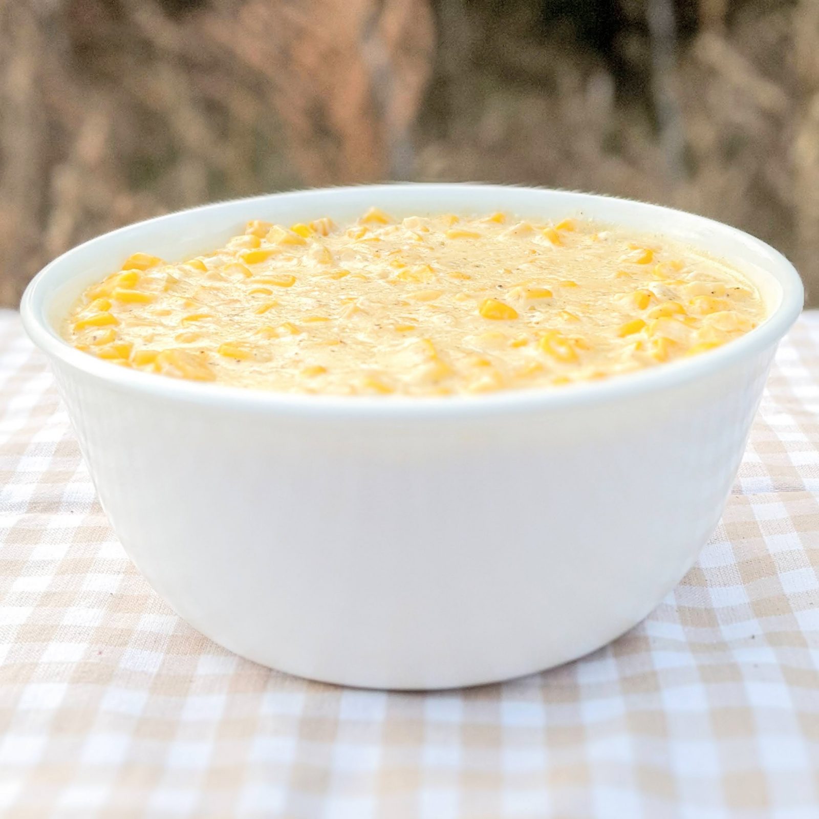 creamed corn in bowl on table