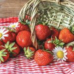 strawberries coming out of basket