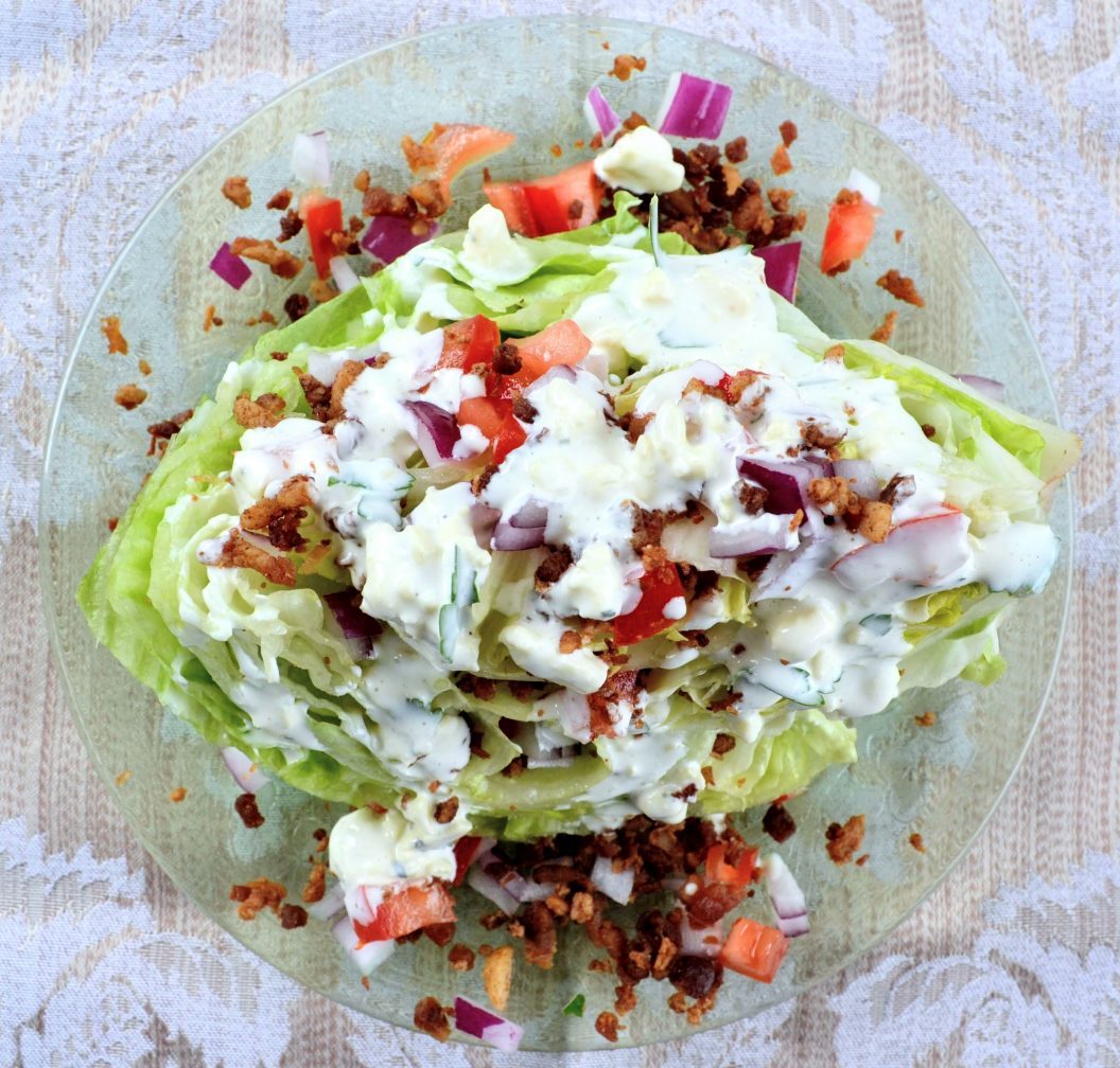 top view of wedge salad on glass plate
