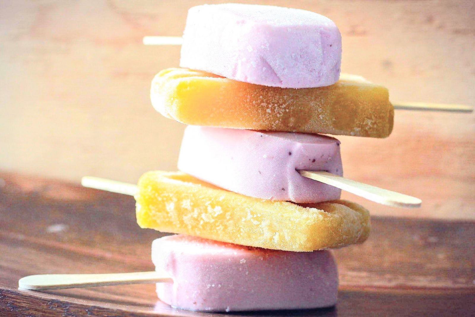 stack of pink and yellow popsicles