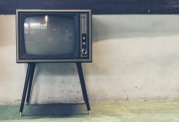vintage tv in front of white wall